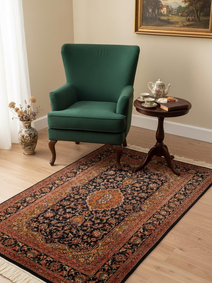 Traditional Persian navy blue Tabriz Kashmir silk hand-knotted rug in living room setting – Swadesh