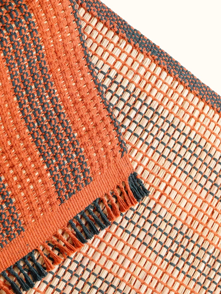 Overhead view of Swadesh Brown Natural Grass Cotton Yoga Mat showcasing its natural color and textured surface ideal for yoga practice.