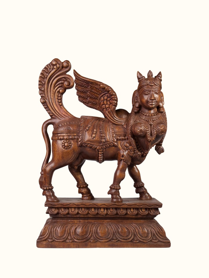 Front view of the Wood Carved Kamadhenu Idol