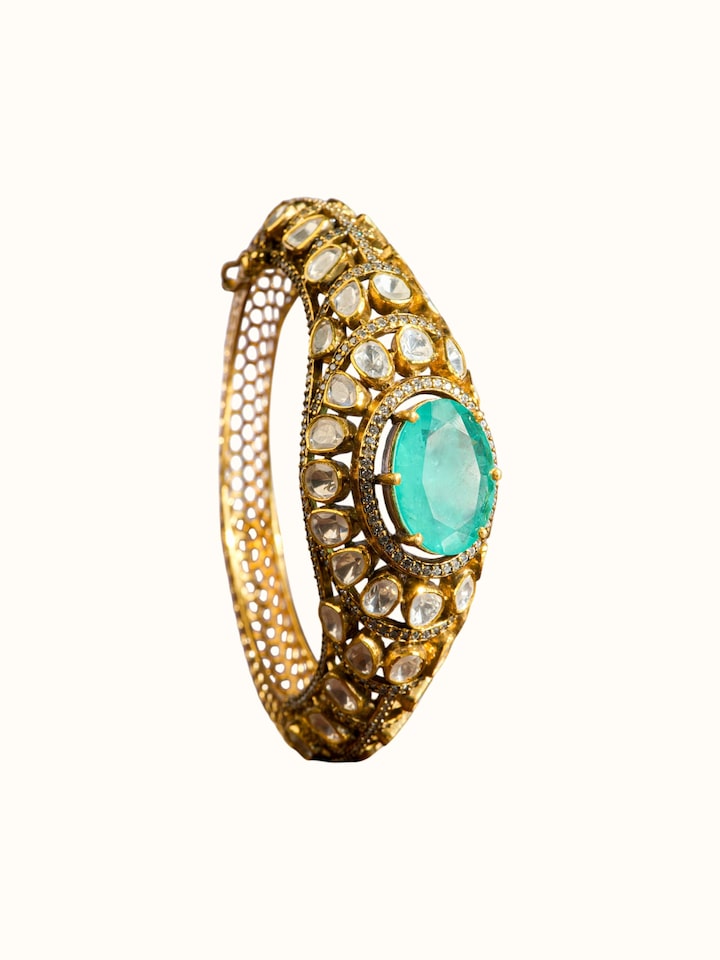 front view of silver smithing gold plated bangle with polished finish