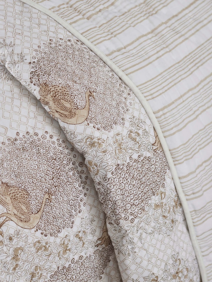 Side view of Shivranjini beige floral cotton Sanganeri block printed double quilt