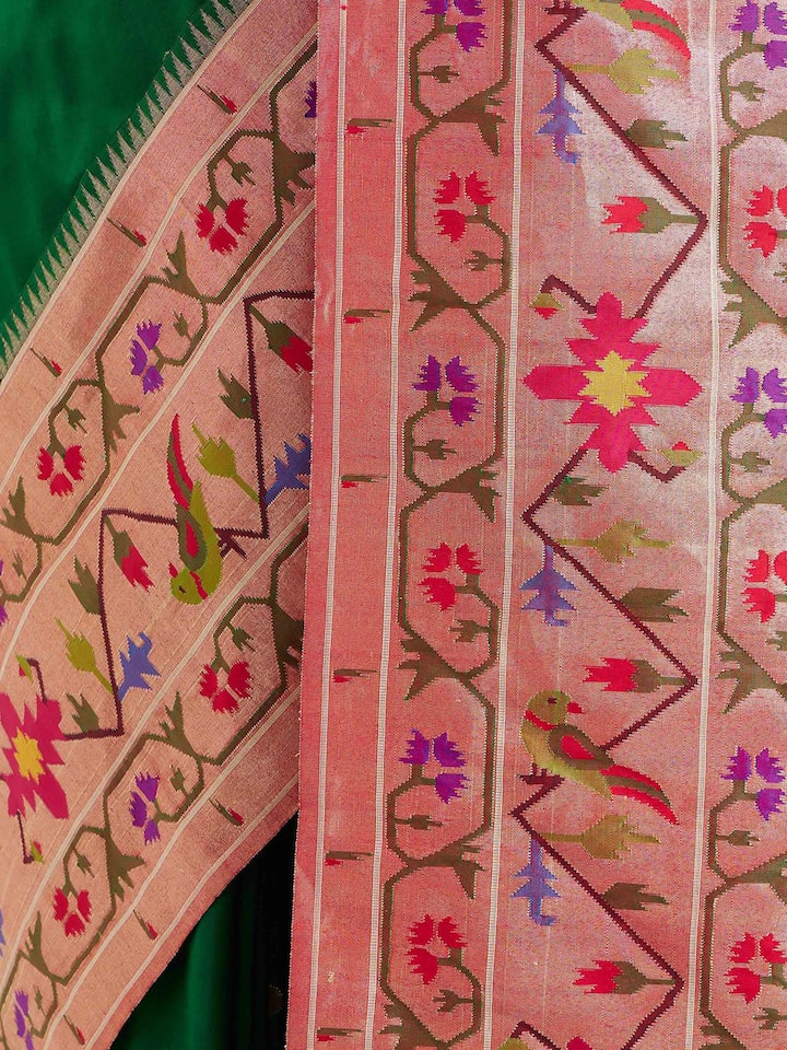 Detail view of green silk Paithani saree showcasing intricate craftsmanship