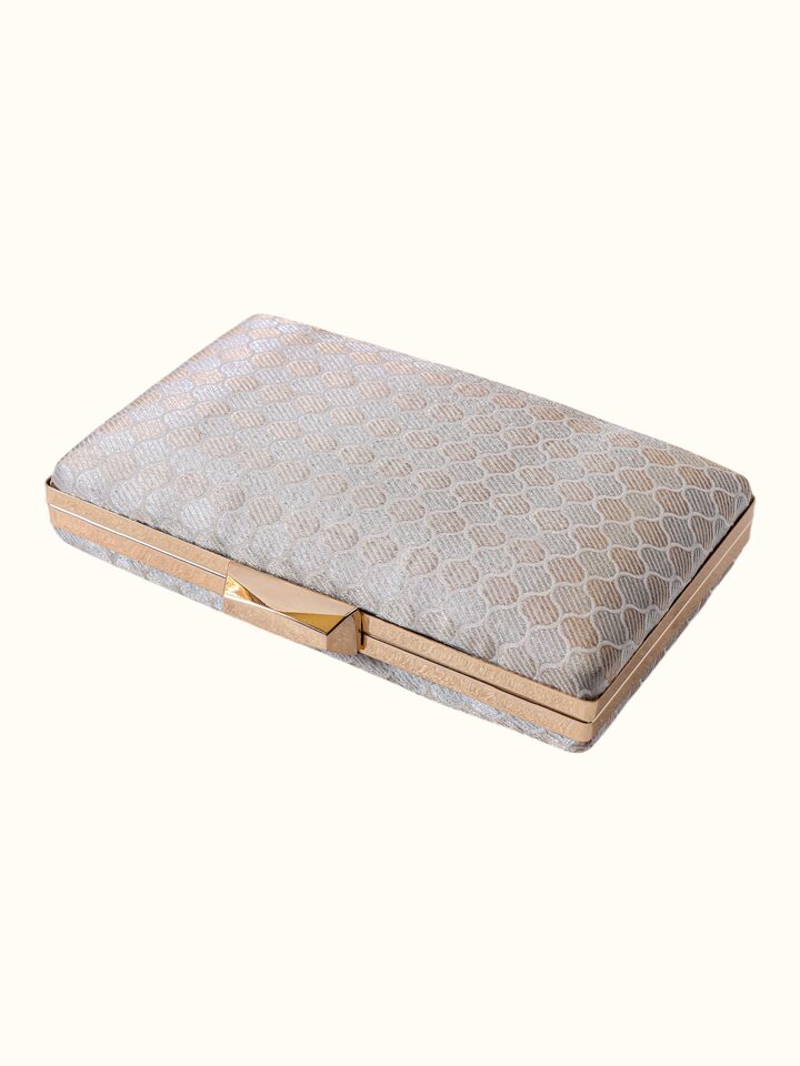 Angled view of the Silver Handwoven Brocade Clutch