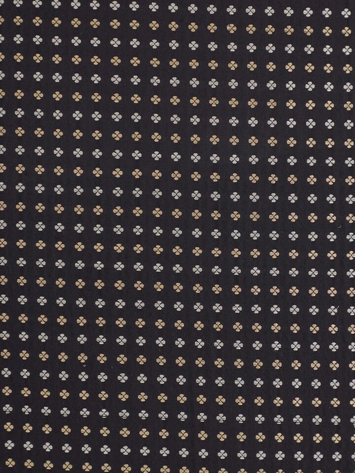 Close-up of Banarasi weave pattern and silk texture on Awadh black striped cushion cover