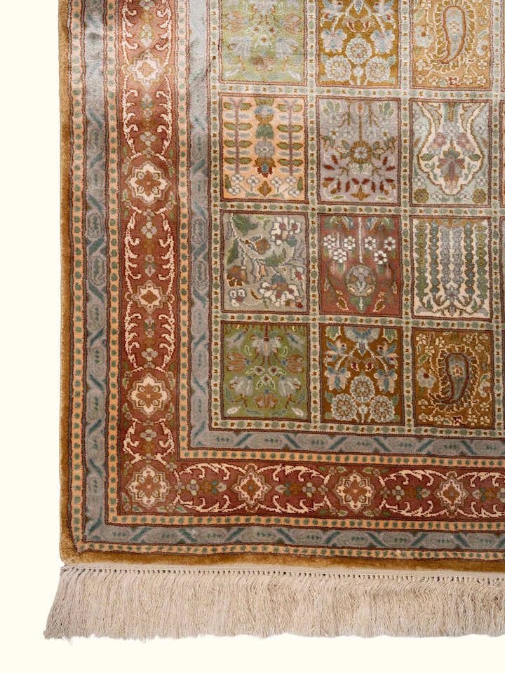 Detail view of Traditional Persian Green Dabdar Kashmir Silk Hand-Knotted Carpet highlighting the intricate pattern and pile texture, from a differ...