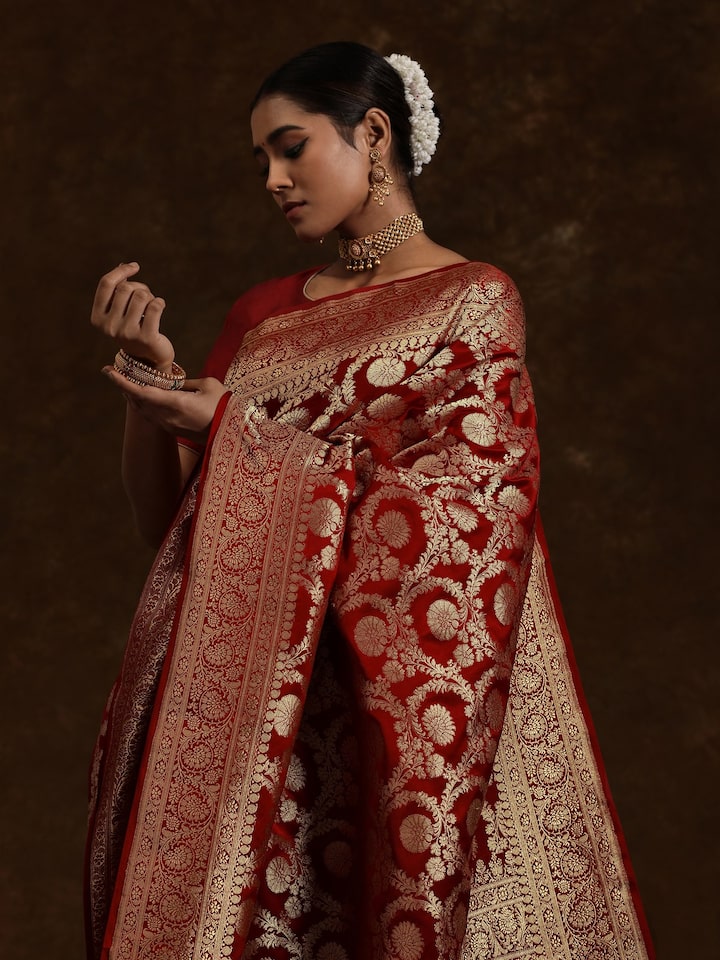 Angled view of Ruby Wine Mulberry Satin Silk Banarasi Saree highlighting intricate Banarasi motifs