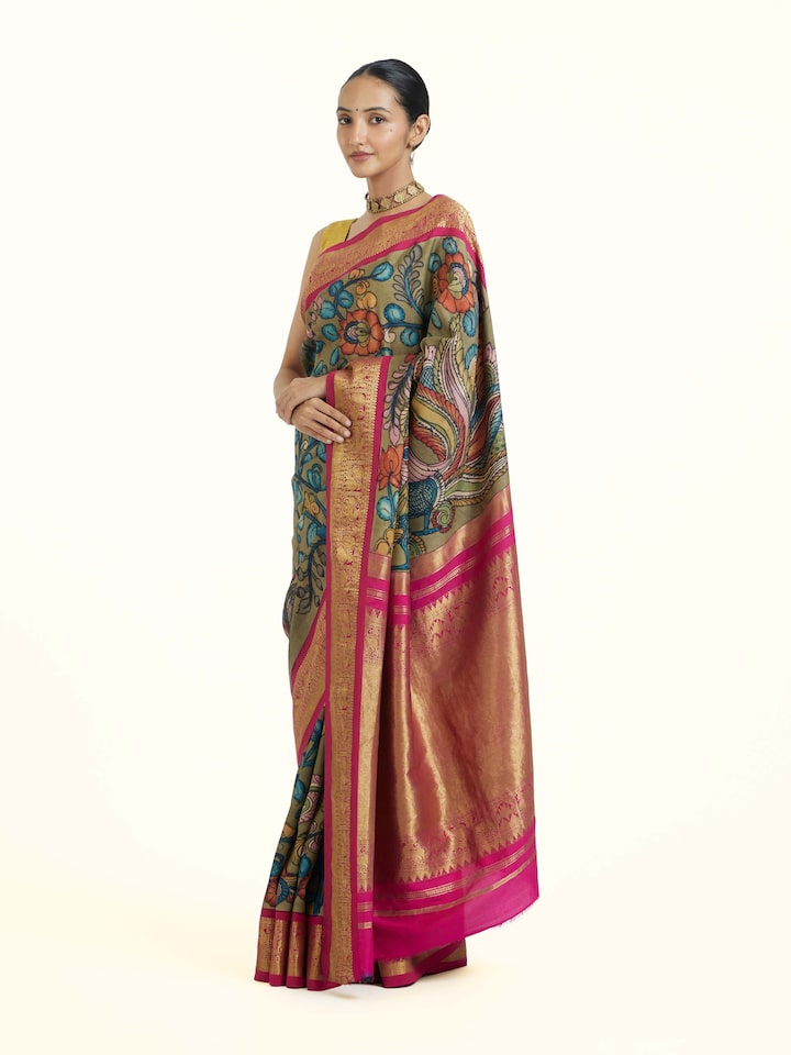 Side view of Maroon Kalamkari Kancheepuram Saree highlighting the detailed craftsmanship and elegant silhouette