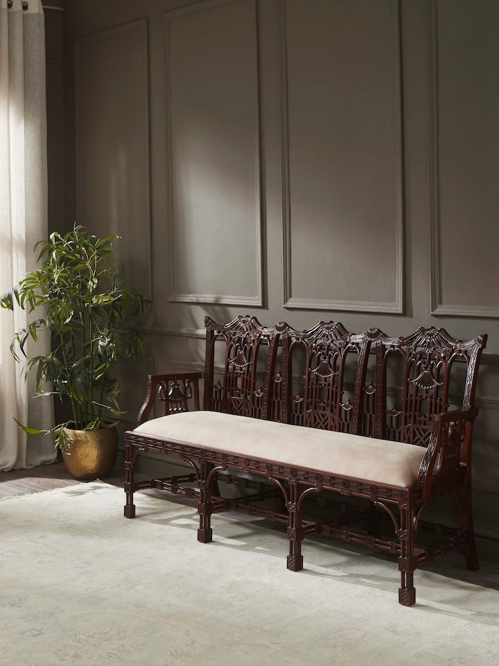 Lifestyle view of upholstered mahogany 3-seater sofa placed in a classic interior setting