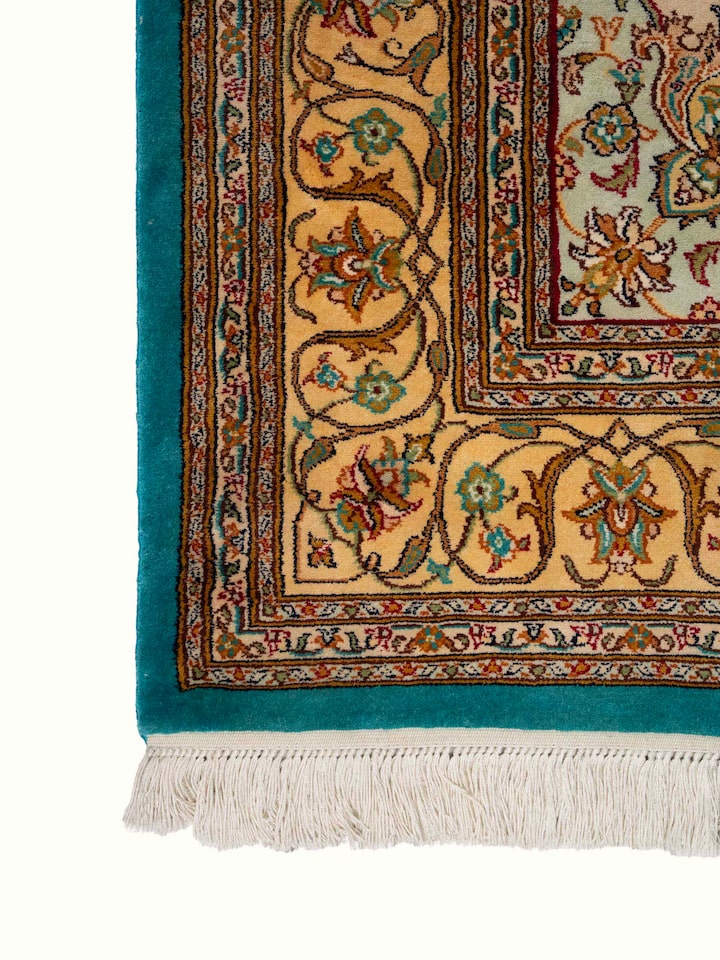 Detail view of Traditional Persian Blue Tabriz Kashmir Silk Hand-Knotted Carpet highlighting the intricate pattern and pile texture