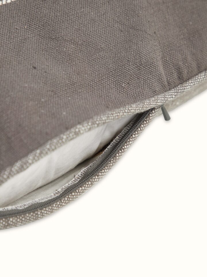 Angled close-up focusing on the texture and detailing of the handloom craftsmanship