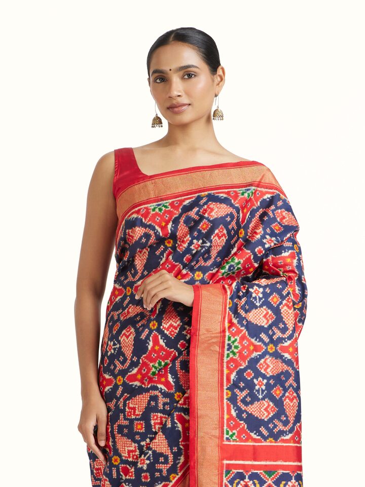 Angled view of Navy Double Ikat Silk Saree revealing the depth of its color and intricate pattern