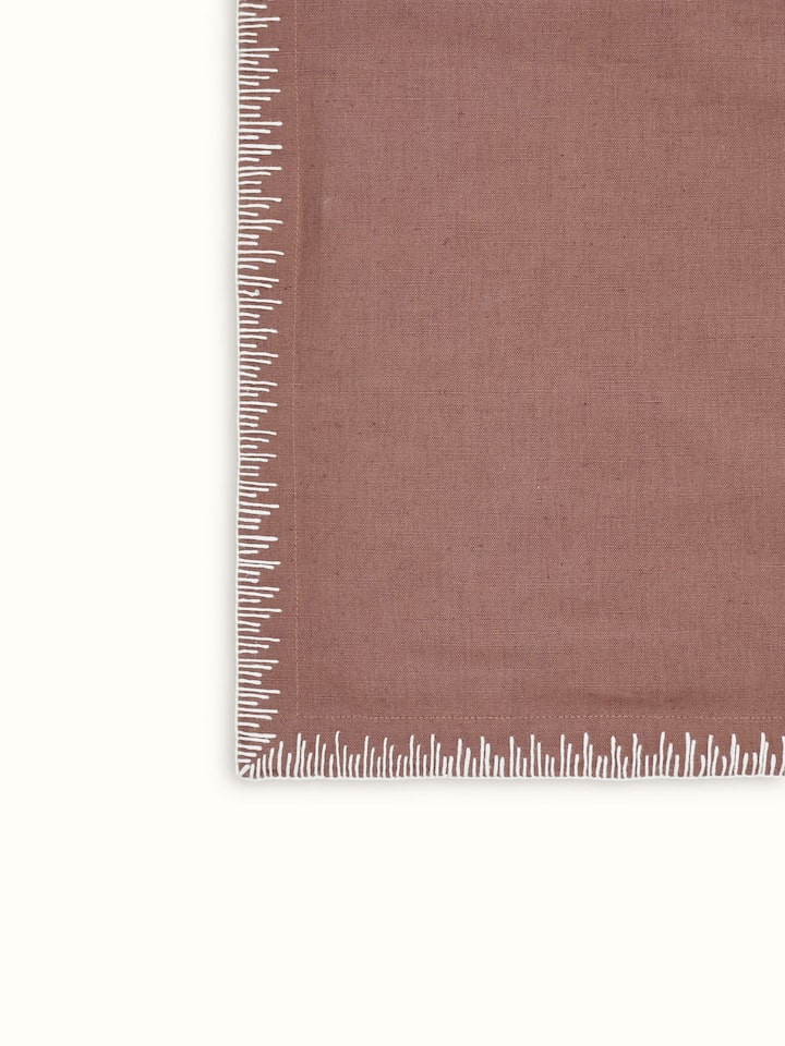 Texture and fabric detail of linen cotton brown embroidered table mat