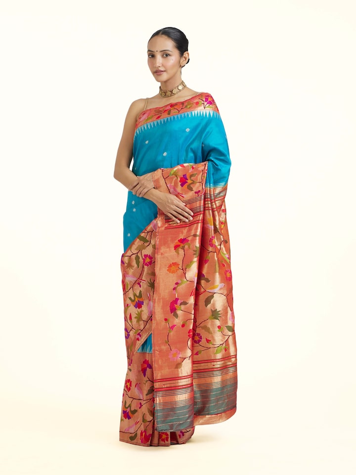 Angled view of the Turquoise Mulberry Silk Paithani Handloom Saree
