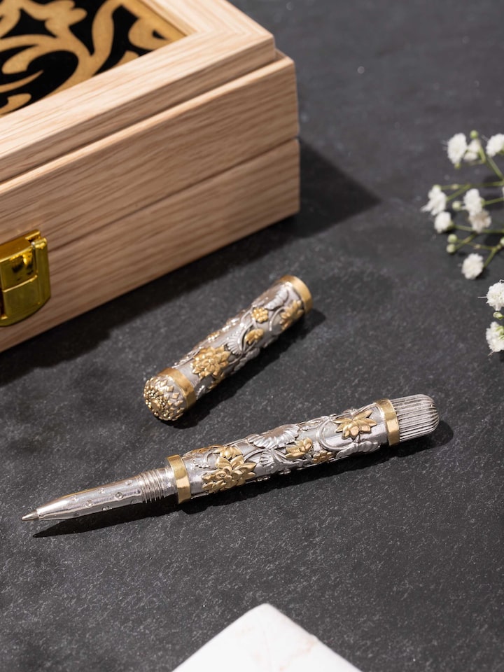 Styled detail view of Silver Smithing Silver Pen held in hand, shown in another styled shot