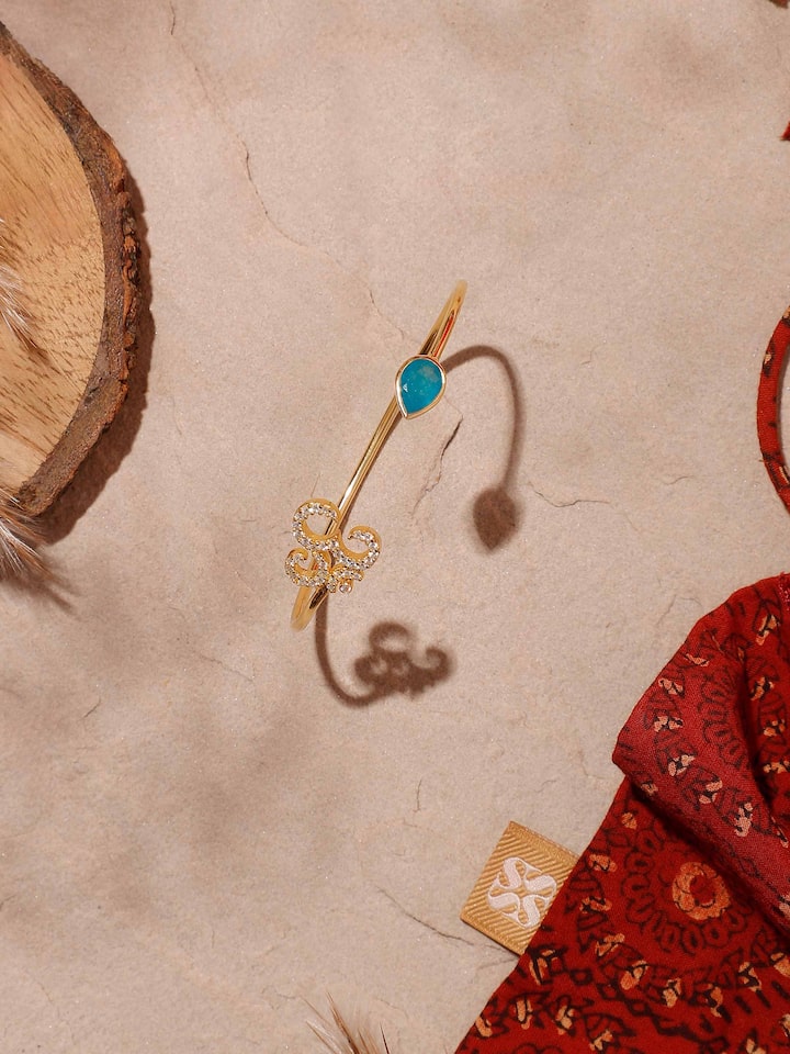 Detailed image of Green White Jade & Om 18K Gold Plated Silver Bracelet displaying the gold-plated silver links and spiritual motif