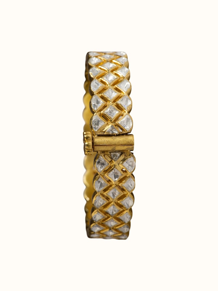 close-up view of silver smithing gold plated bangle texture