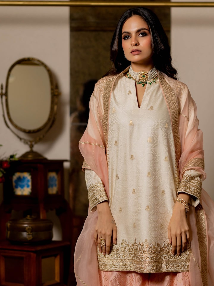 Angled view of the Off-white Silk Hand Embroidered Patchwork Kurta Set (2 Pcs)