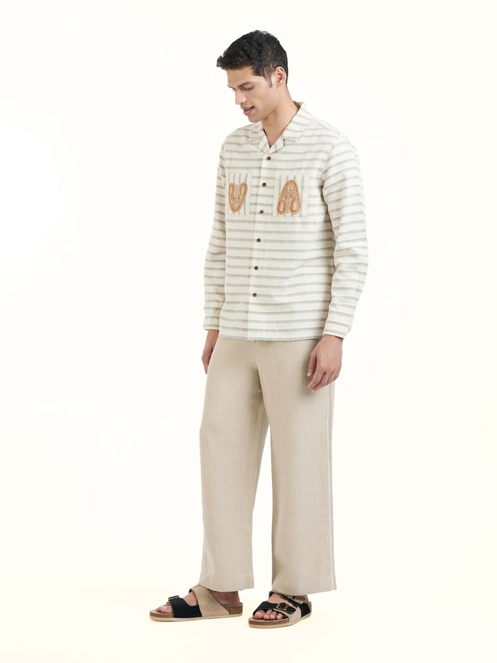 Side view of Ivory Kutchi Embroidered Shirt highlighting the detailed craftsmanship and elegant silhouette