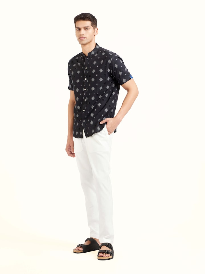 Side view of black cotton Telangana Ikat shirt showing structured fit and clean silhouette