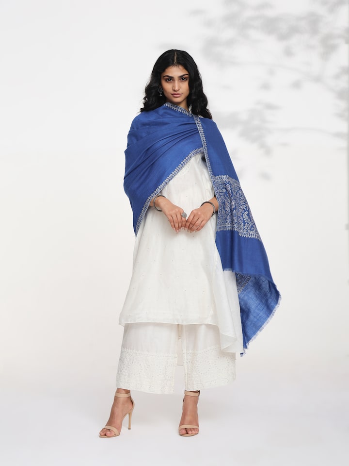 Side view of blue Palledar Sozni embroidered shawl showcasing drape and flow