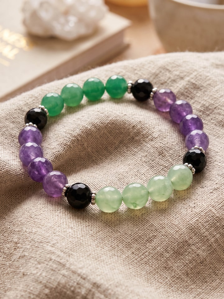 Styled view of Gemstone Garnet, Black Onyx, Amethyst & Green Onyx Silver Bracelet worn on the wrist, showing how it looks styled, from a different...