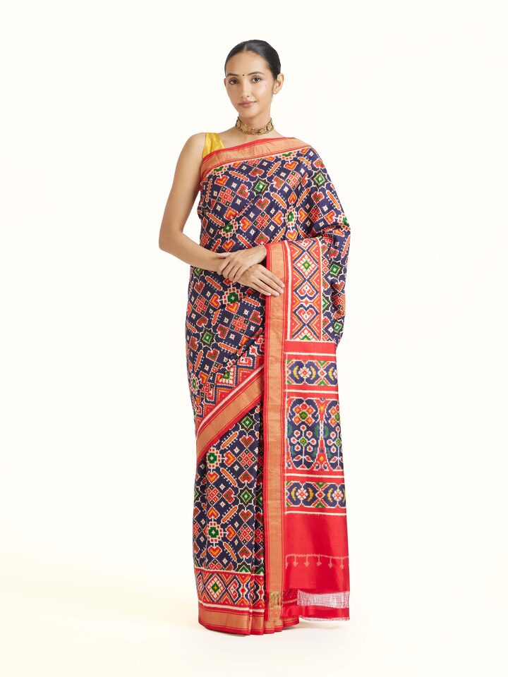 front view of navy double ikat silk saree with traditional pattern