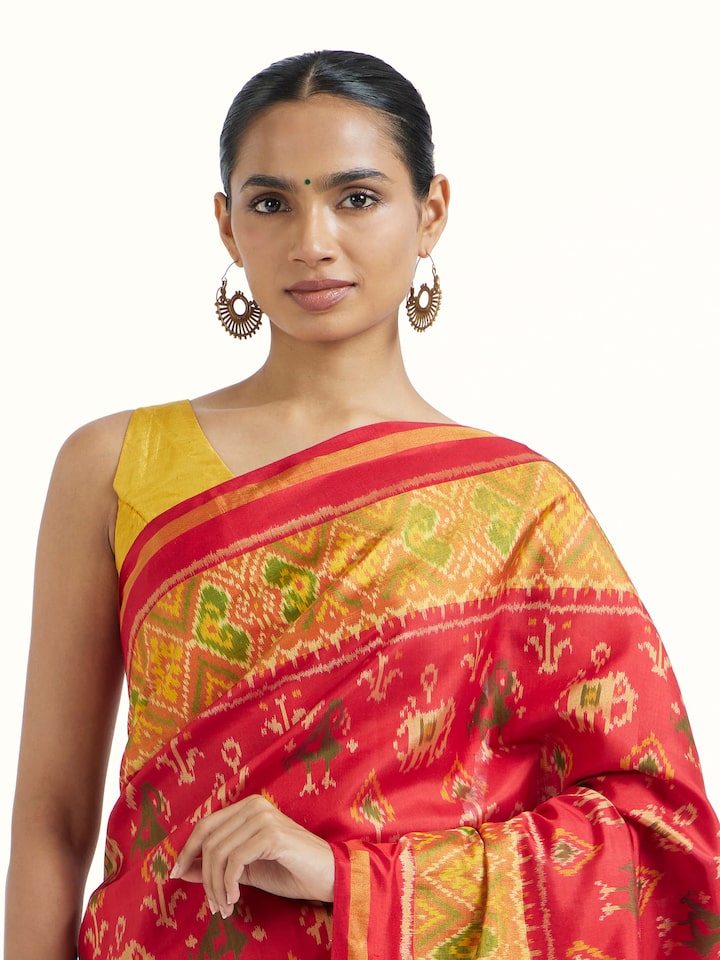 Angled view of Rajkot Patola Ikat Saree revealing the depth of its color and intricate pattern