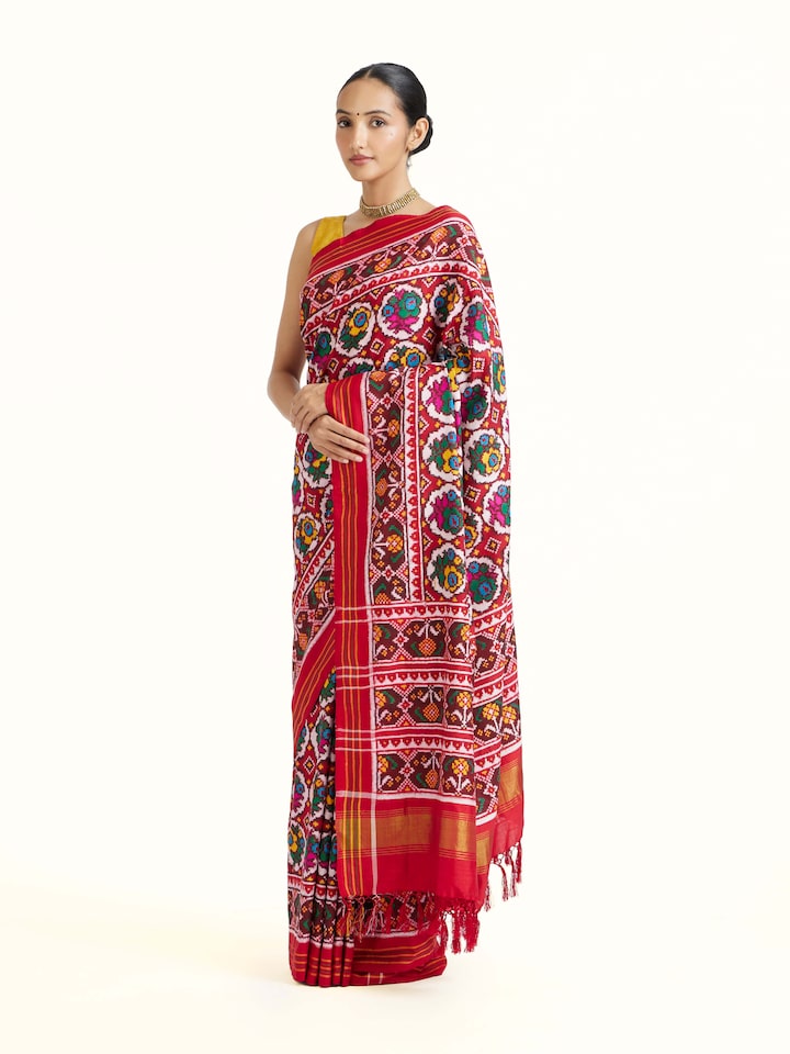 Side view of Red Patan Patola Saree highlighting the detailed craftsmanship and elegant silhouette