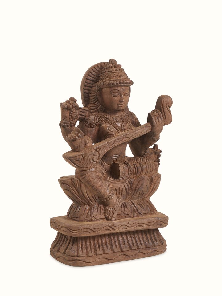 Side view of the Wood Carved Saraswati Devi Idol