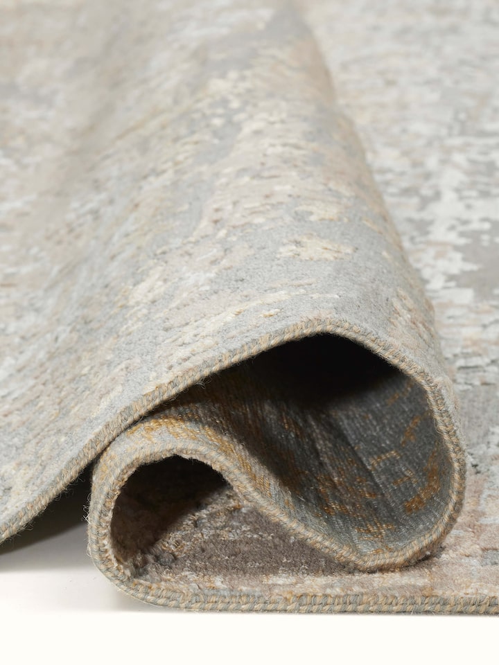 Angled perspective focusing on the carpet’s distressed details and craftsmanship