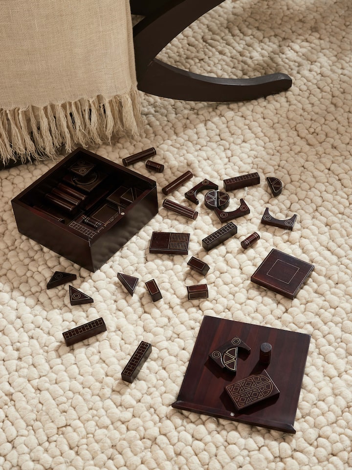 Side view of Tarkashi Construction Block Game displaying the blocks arranged in an intricate pattern