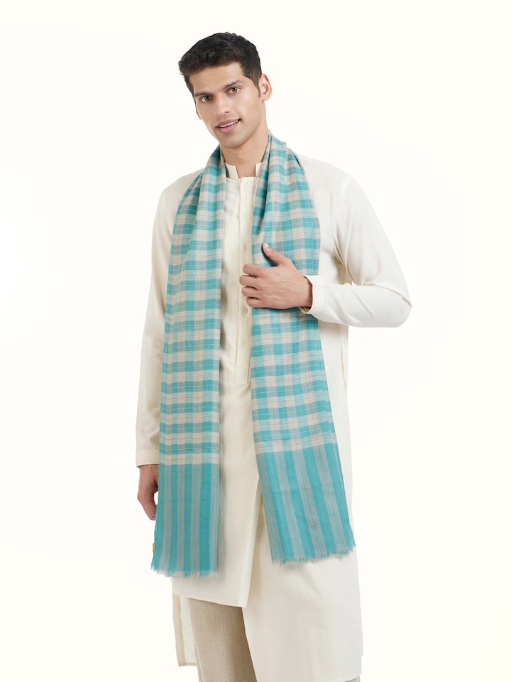 Angled view of aqua cashmere stole emphasizing cashmere quality