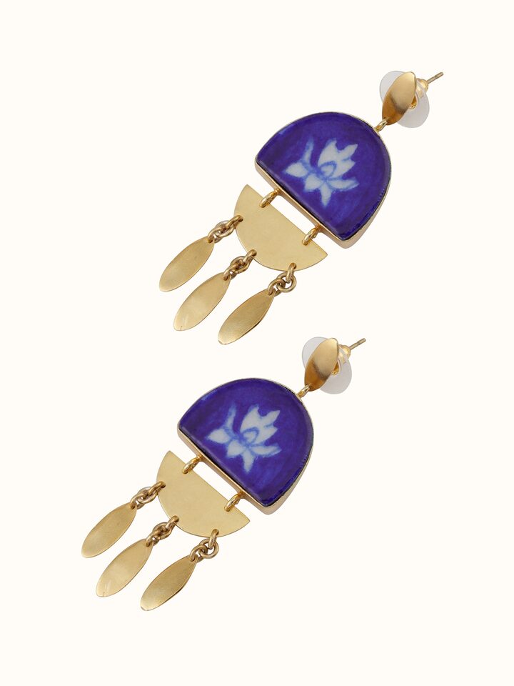 Detailed front view of blue pottery drop earrings with intricate patterns and fine detailing
