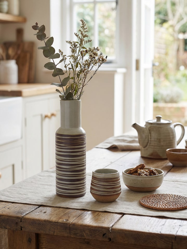 Styled view of Studio Pottery Ceramic Carafe & Cup Set (2 Pcs) worn on the ear, showing how it looks styled