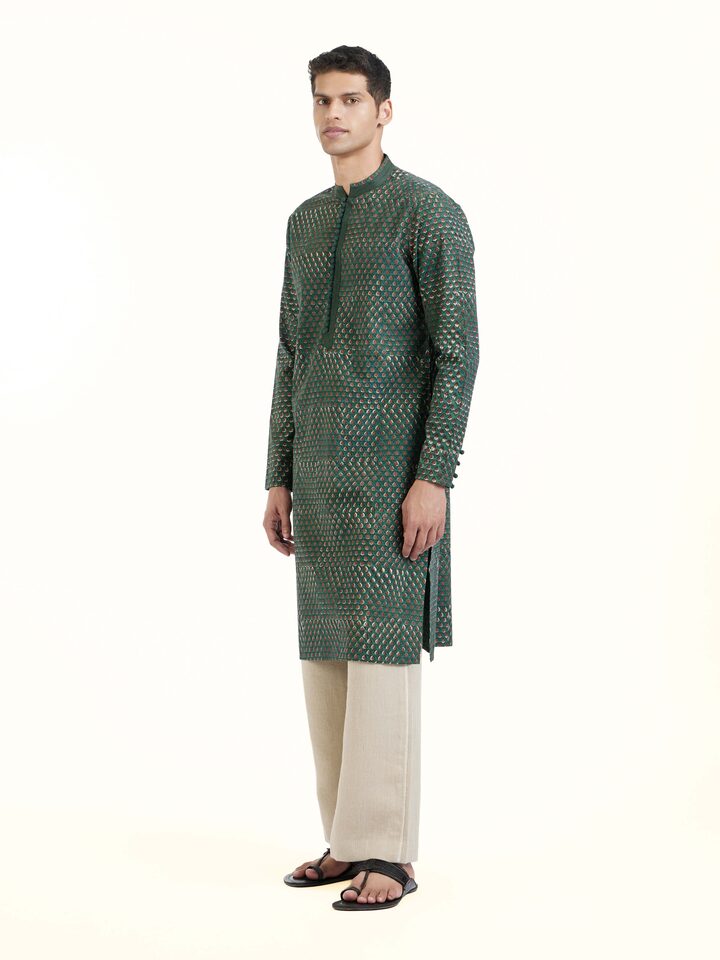 Side view highlighting tailored fit and cotton drape