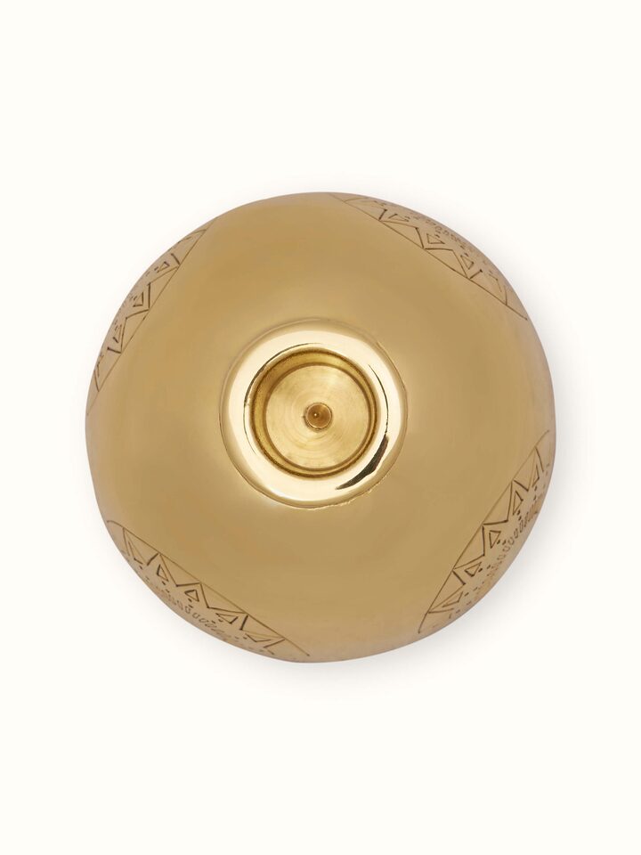 Detailed view of Brass Candle Stand Green Color with a focus on the intricate patterns and polished brass