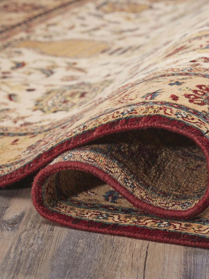 Side perspective of Ziegler Jaipur hand-knotted rug in gold tone showing textured weave