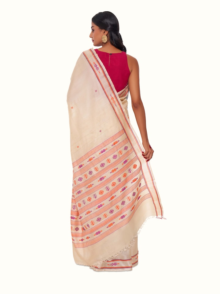 Back view of off-white Tussar silk saree displaying pallu and overall fall