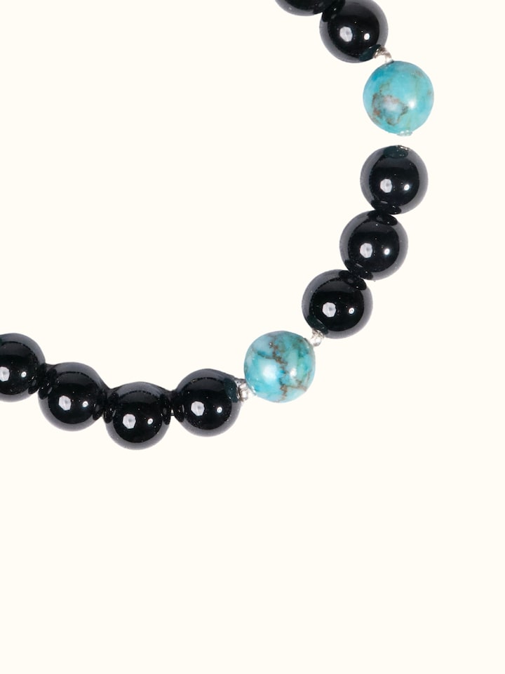 Close-up view of Gemstone Black Onyx & Turquoise Silver Bracelet highlighting the beadwork and stone detail