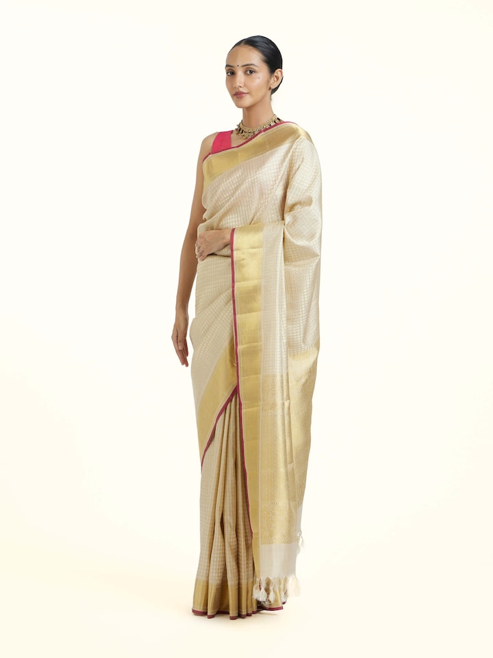 Side view of Beige Kancheepuram Silk Zari Saree highlighting the detailed craftsmanship and elegant silhouette