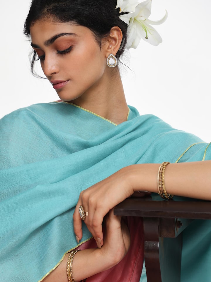 Detail view of teal cashmere kaaj embroidered handwoven stole showing fine cashmere texture and hand embroidery