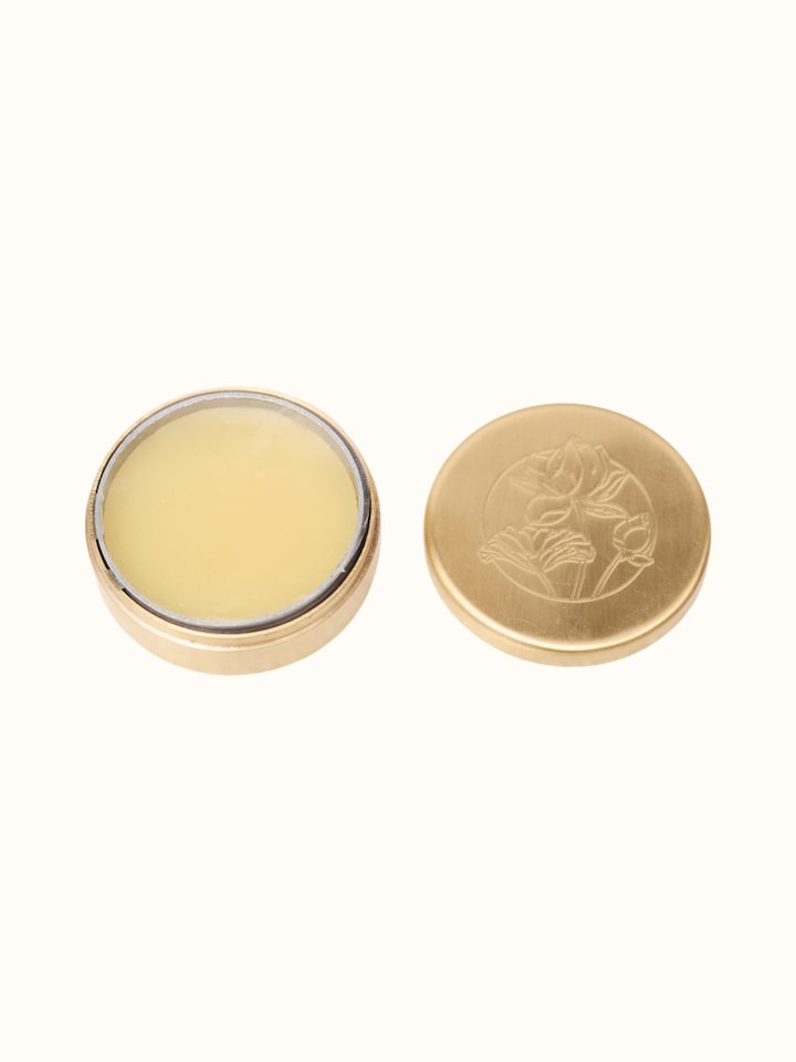 Detail view of Solid Perfume Madhu highlighting the packaging label detail