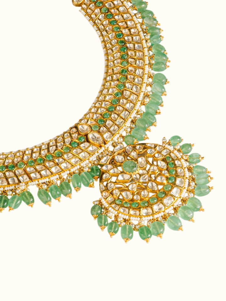 detail view of silver smithing gold plated jadau necklace design