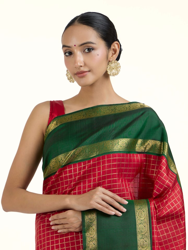 Angled view of green silk Kancheepuram saree highlighting traditional weave