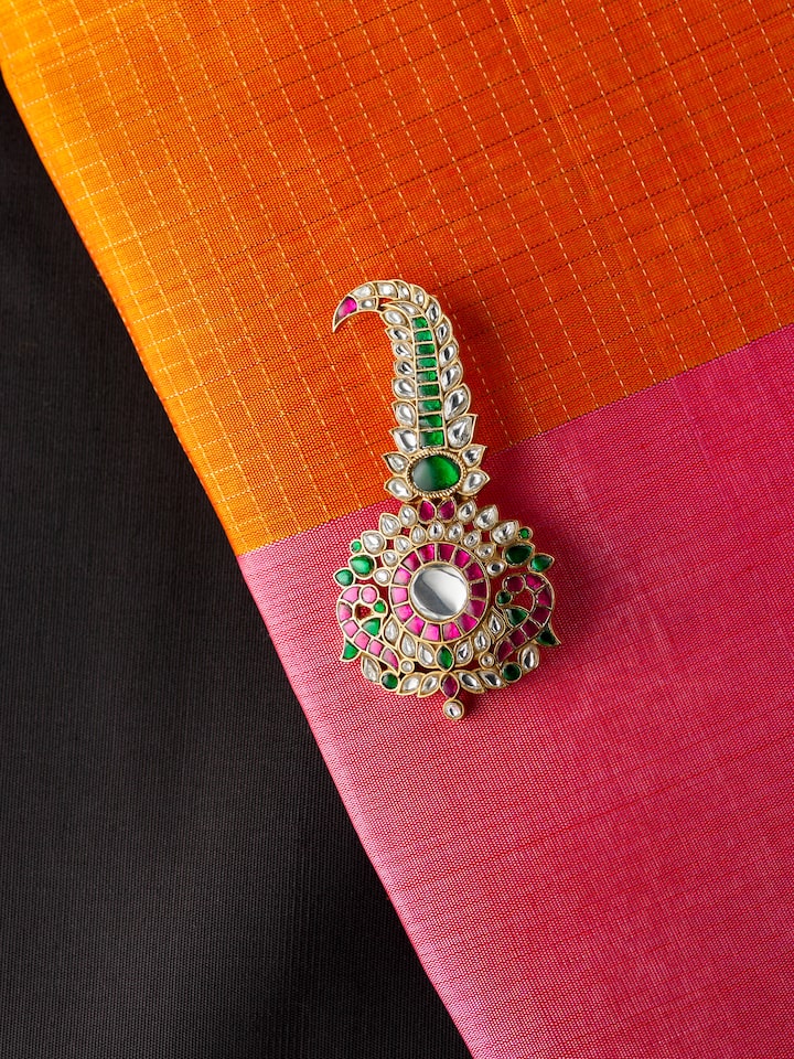 lifestyle view of silver smithing yellow gold brooch pin