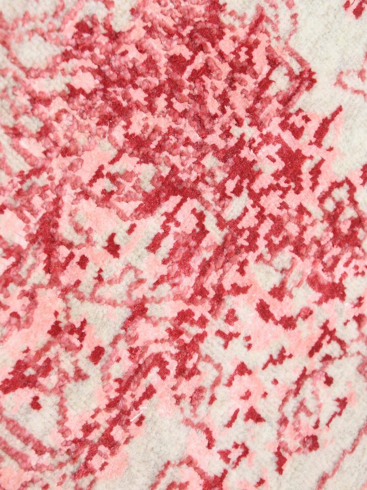Detail view of Transitional Persian Pink Bhadohi Wool & Bamboo Silk Hand Knotted Rug highlighting the intricate pattern and pile texture, with a sl...