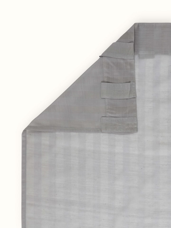 A rear view showing the sheer fabric quality, weave detail, and length of the Pragya Wide Stripe Maheshwari Curtain by Swadesh.