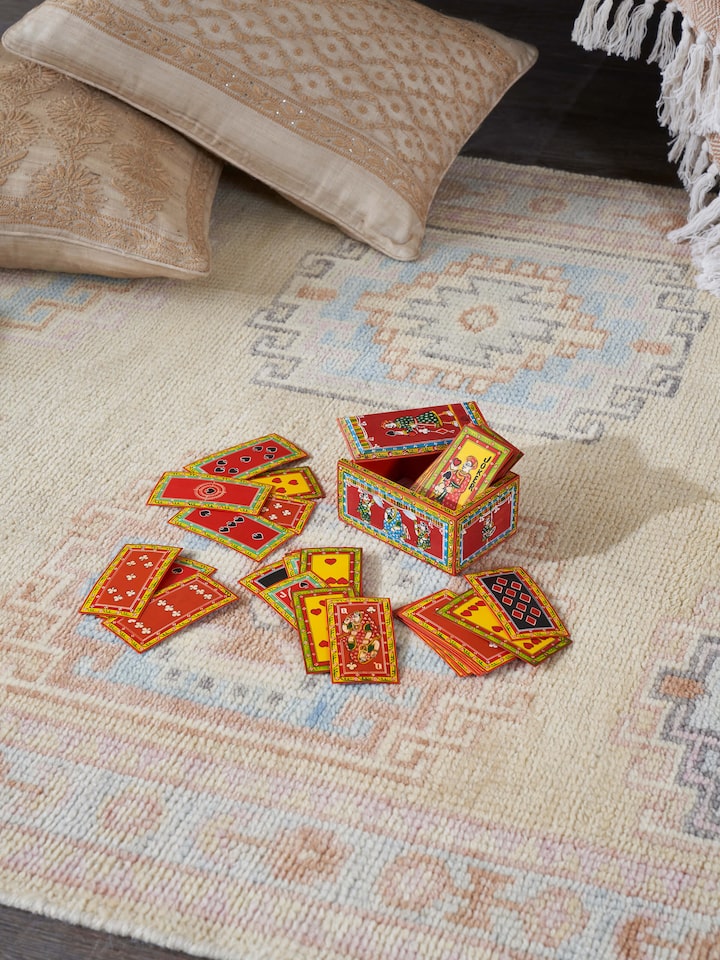 Side view of Ganjifa paper cards (54pcs) showcasing their elaborate designs and bright colors