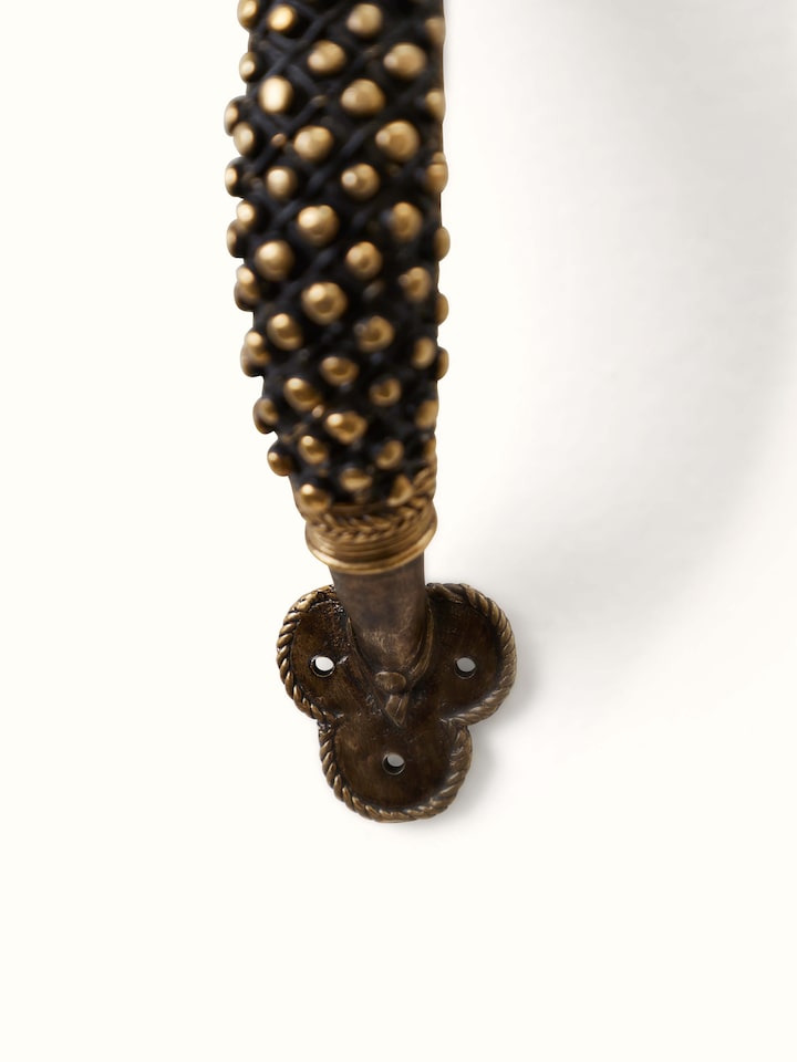Angled view of Dhokra Brass Small Balls Door Handle showing the elegant design and detailed brass finish