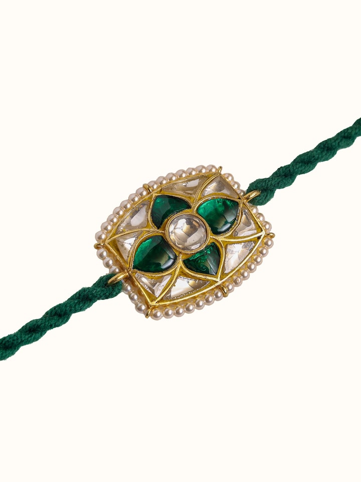 Detail view of Silversmithing Rakhi highlighting the stone setting and metalwork detail